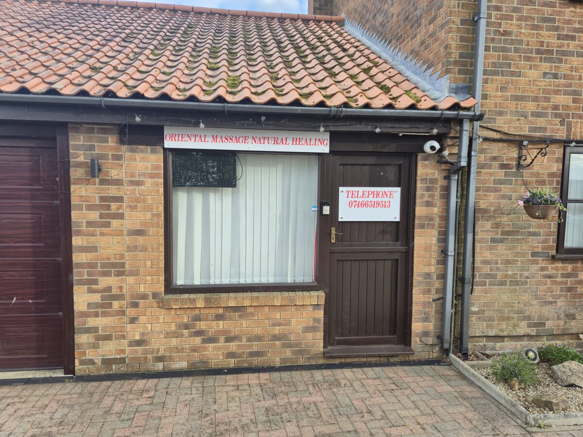 Updated front door sign at Oriental Massage