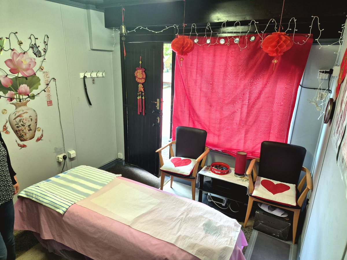 Massage bed prepared for an Oriental massage appointment